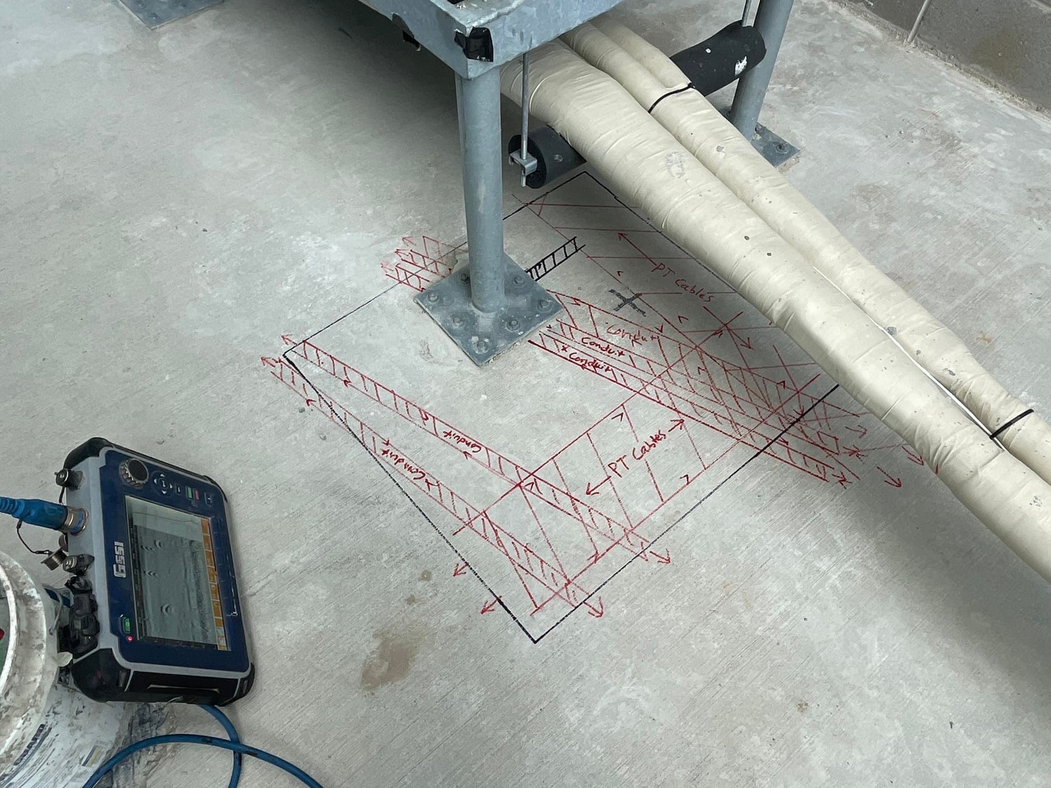 Crew member documenting scanning results on site.