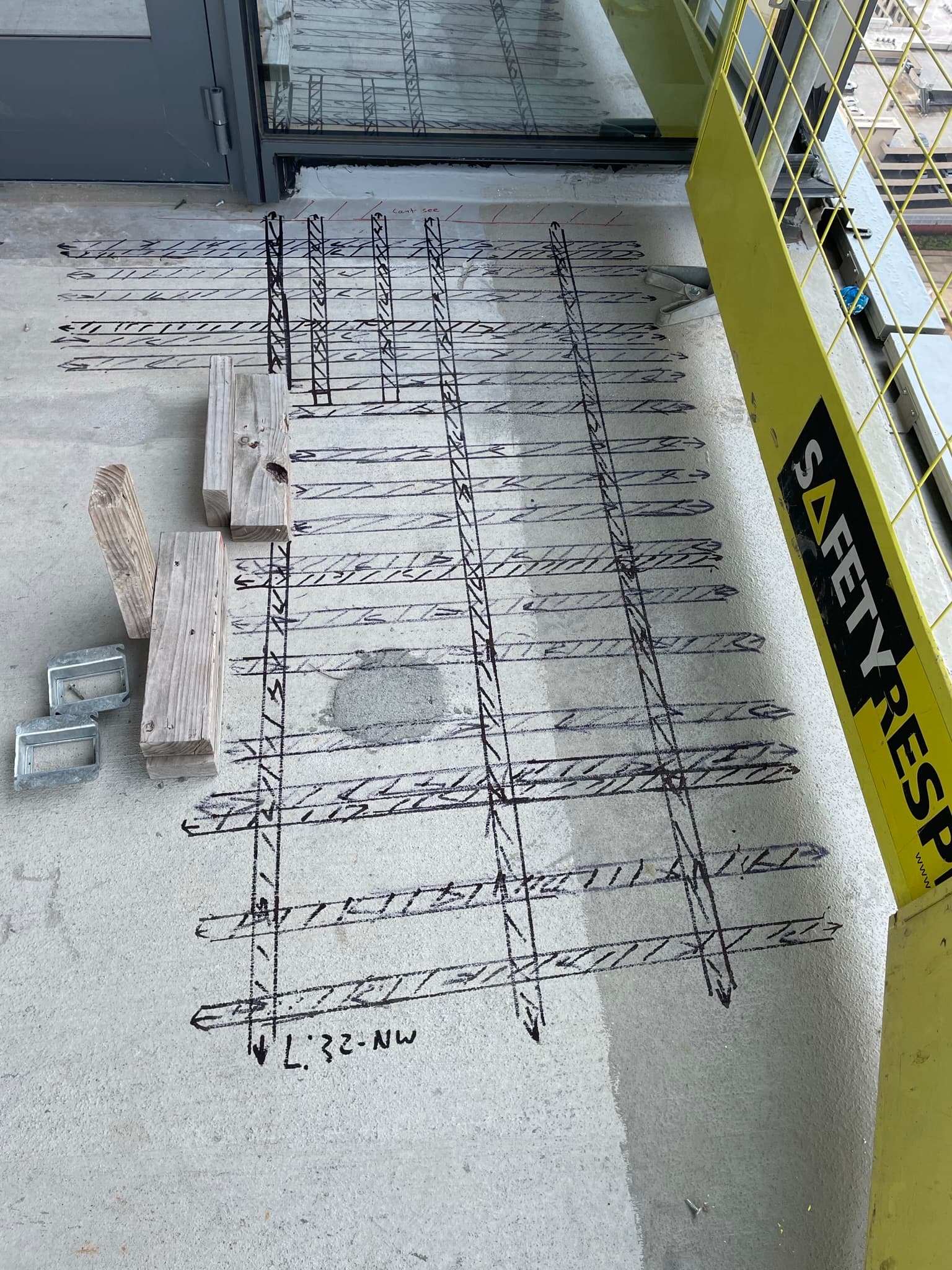 Crew member performing utility locating on a commercial project.