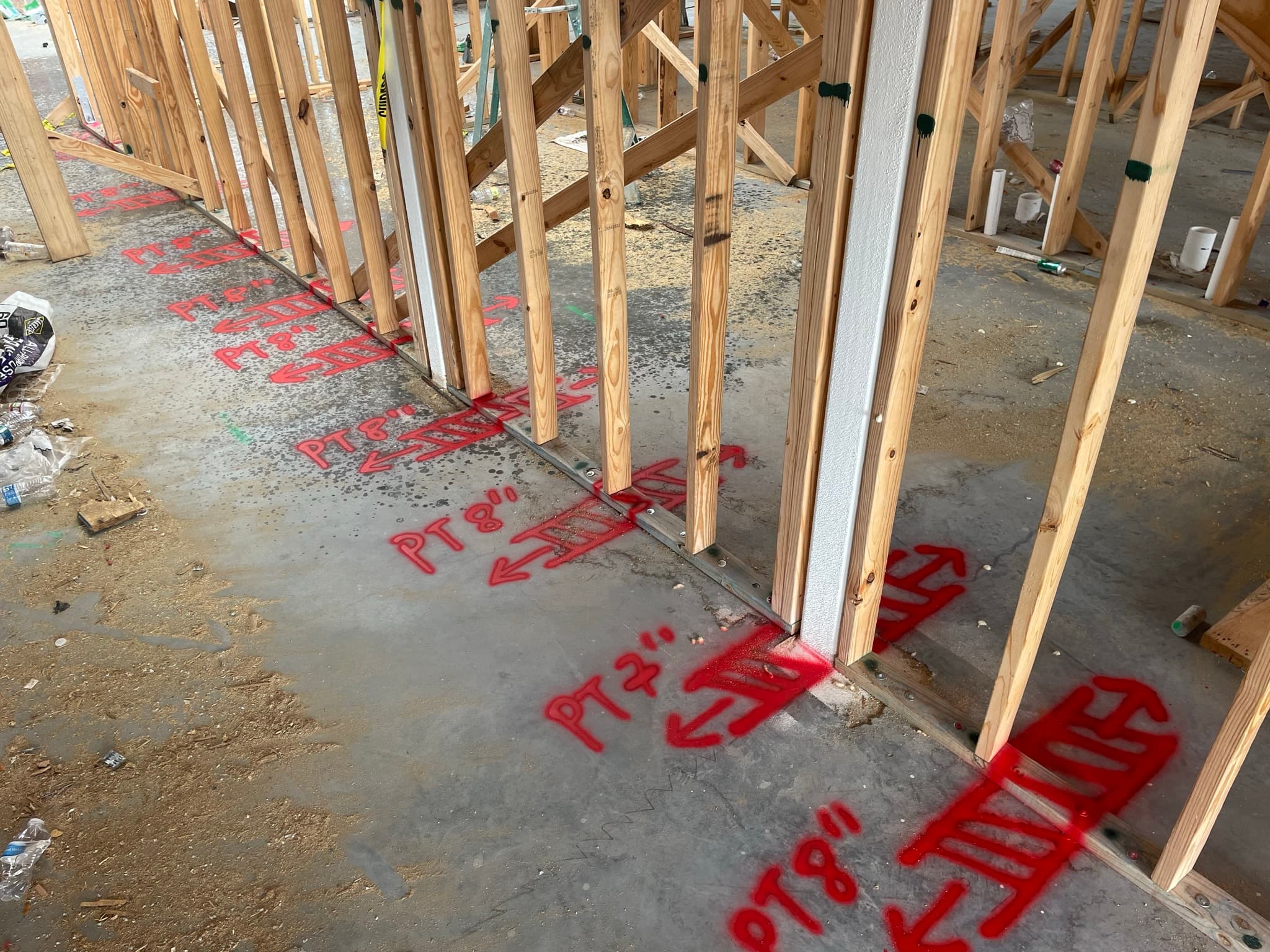 On-site scanning and marking work during a commercial construction project.