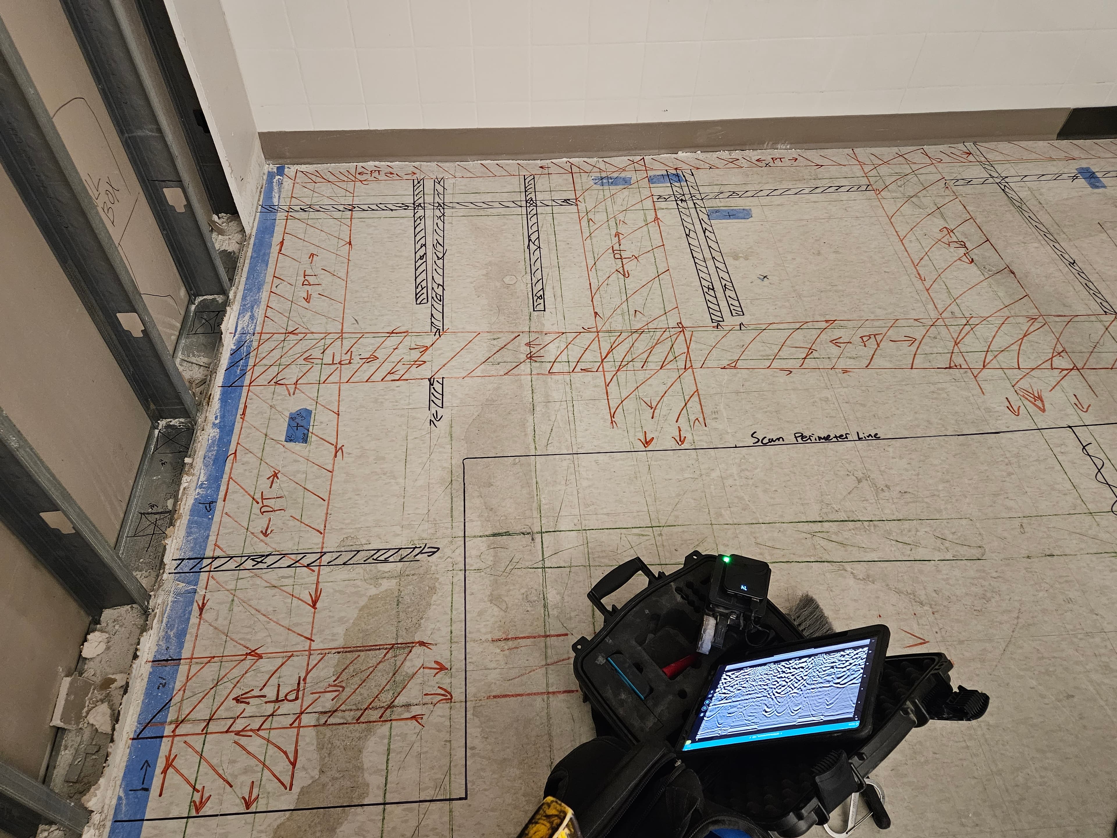 Completed subsurface utility locating job with marked lines.